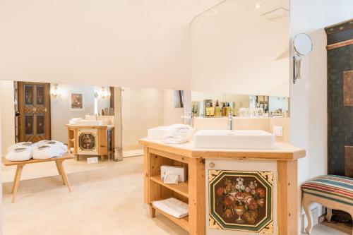a bathroom with a sink and a mirror at Haus Barbarahof in Altenmarkt im Pongau