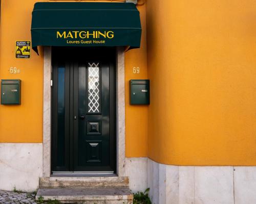 Muka bangunan atau pintu masuk Matching Loures Guest House