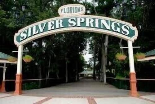 a sign for a sunken entrance to a disney resort at Historic Carriage House Downtown 2 bedroom 1 bath in Ocala