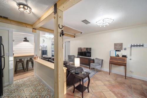 a living room with a couch and a table at Historic Carriage House Downtown 2 bedroom 1 bath in Ocala