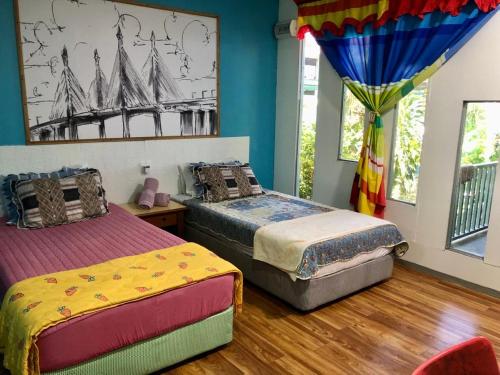 Postel nebo postele na pokoji v ubytování WAN'S ROOMSTAY LANGKAWI