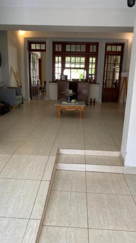 a large living room with a bench in the middle at Sayani Posada in Chilecito