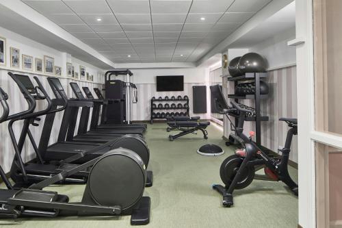 a gym with treadmills and machines in a room at La Concha Key West, Autograph Collection in Key West