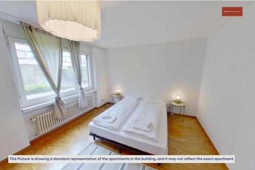 Postel nebo postele na pokoji v ubytování Cozy & Basic 4-Bedroom Stay Near Zurich