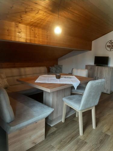 a room with a table and a chair and a desk at Haus Sorgschrofen in Pfronten