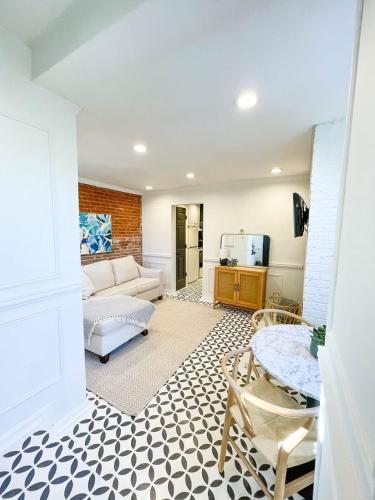 a living room with a couch and a table at Charming and Historic Apartment in Capitol Hill in Washington, D.C.