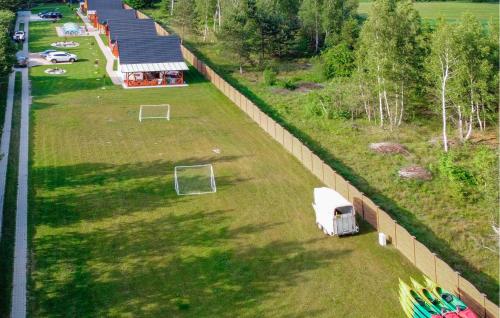 an aerial view of a fence and a field with a soccer field at Awesome Home In Jamno With Sauna in Jamno