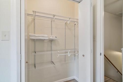 a bathroom with a towel rack and towels at USNA Home In Downtown Annapolis in Annapolis