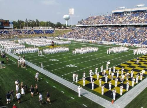 a football team on the field at a game at USNA Home In Downtown Annapolis in Annapolis