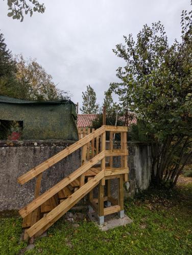 a wooden ramp leading up to a building at Gîte du moulin de la motte in Ambleville