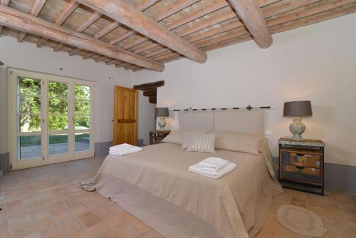 Postel nebo postele na pokoji v ubytování Villa Il Troscione