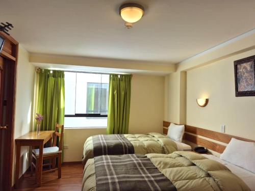 Giường trong phòng chung tại Florida del Inca Hotel