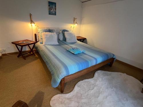 Ein Bett oder Betten in einem Zimmer der Unterkunft Logis Saint Léonard