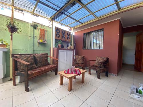a living room with a couch and a table at Apartamento Sindempart in Coquimbo