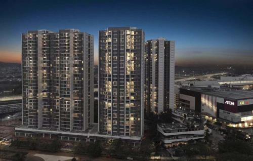 a group of tall buildings in a city at night at Sky House BSD 3 Bedroom 70m2 View Pool Dan Garden in Samporo