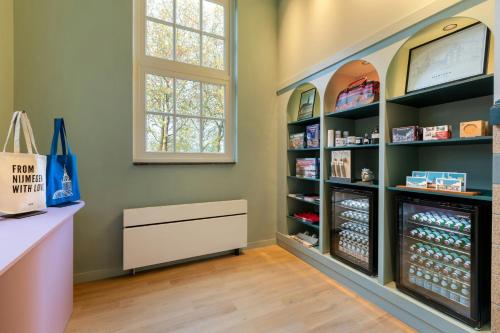 a room with a pharmacy with a pharmacyacistasteryasteryasteryasteryasteryasteryastery at The Rebyl, Nijmegen, a Tribute Portfolio Hotel in Nijmegen