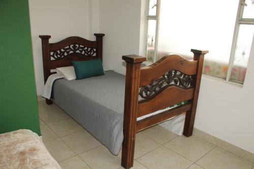 Postel nebo postele na pokoji v ubytování Hotel Kolonial