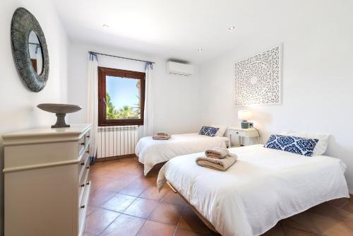 Ένα ή περισσότερα κρεβάτια σε δωμάτιο στο Villa Elvissa
