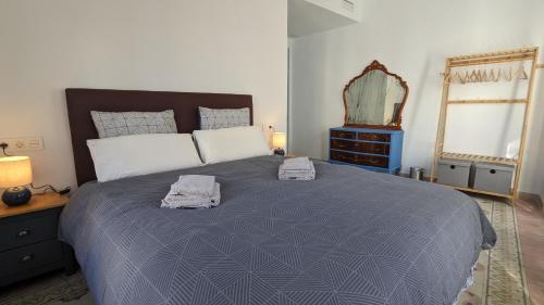 Ένα ή περισσότερα κρεβάτια σε δωμάτιο στο Casa EntreAzules l Vivienda Rural