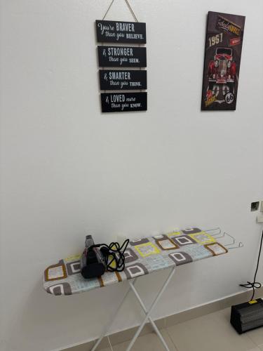 a table that has a table with a controller on it at شقة أرضية عائلية مكونة من غرفتين نوم وصالة ومطبخ 3 in Riyadh