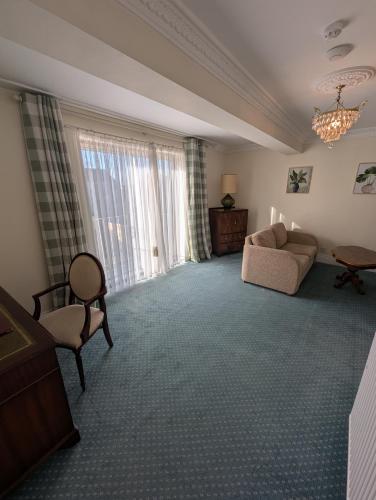 Ένα ή περισσότερα κρεβάτια σε δωμάτιο στο The Walnut Tree Hotel