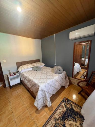 Postel nebo postele na pokoji v ubytování Casa agradável, próximo a Gramado