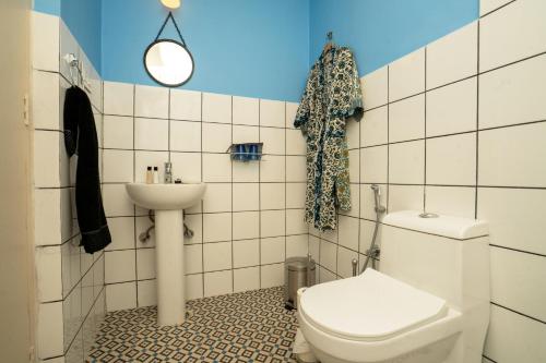 a bathroom with a toilet and a sink at Aakash Heritage Haveli in Jodhpur