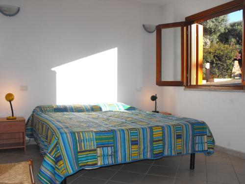 A bed or beds in a room at Borgo Le Logge