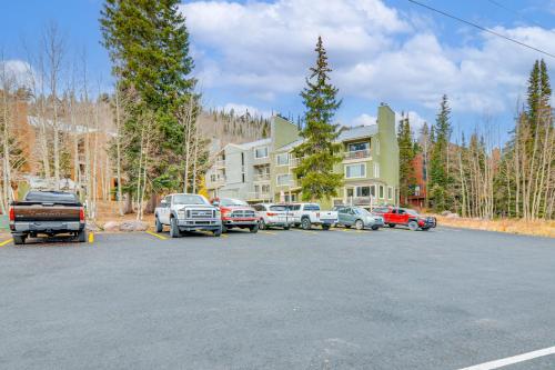 a parking lot with cars parked in front of a building at Walk to Giant Steps Multi-Level Brian Head Condo! in Brian Head