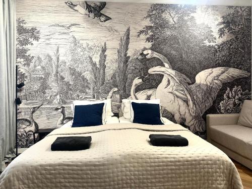 a bedroom with a large bed with a wall mural at Odrzańska 17B Apartment - Self Check-In 20h in Wrocław