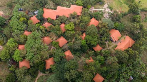an overhead view of an orange building in trees at Kabalega Resort - Hoima in Hoima