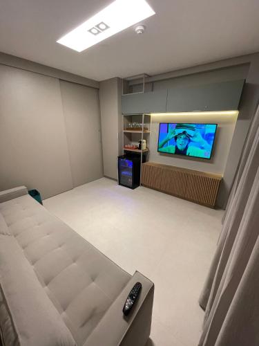 TV a/nebo společenská místnost v ubytování Flat Eco Resort Praia Dos Carneiros