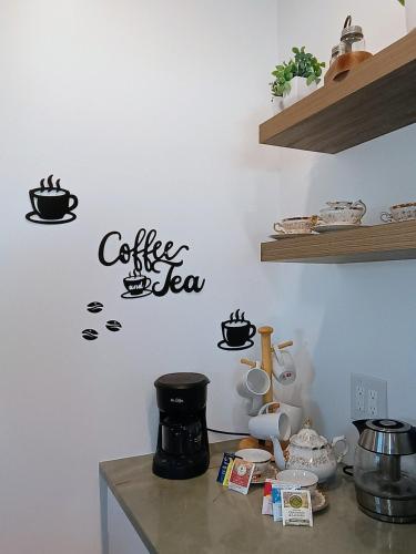 a kitchen counter with a coffee sign on the wall at St Pete heated pool hot tub 5 min to the beach in St Petersburg