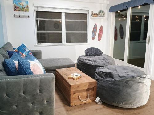 a living room with two couches and a coffee table at St Pete heated pool hot tub 5 min to the beach in St Petersburg