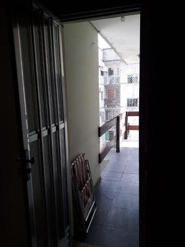 an open door to a room with a balcony at Arbricot in Rio das Ostras