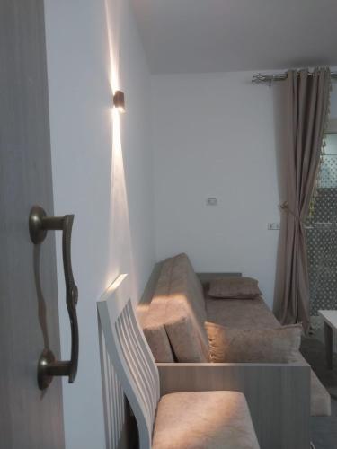 a set of stairs in a room with a chair at Royal residence in Marsa Alam