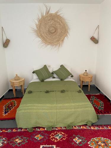 Postel nebo postele na pokoji v ubytování Chambre avec vue sur le océan