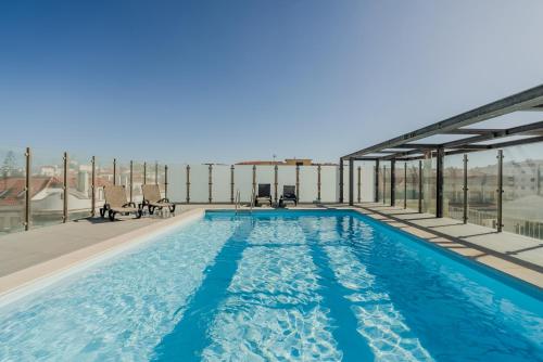 a swimming pool on the roof of a building at H2O Apartment - Rooftop with pool in Santa Cruz in Santa Cruz