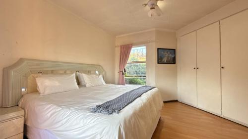 Ένα ή περισσότερα κρεβάτια σε δωμάτιο στο Papillon Guesthouse