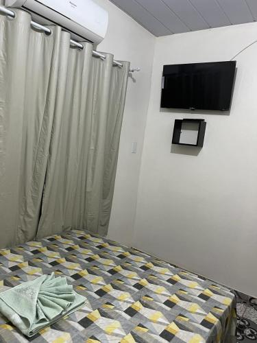 Μια τηλεόραση ή/και κέντρο ψυχαγωγίας στο Pousada Irmãos Perrone