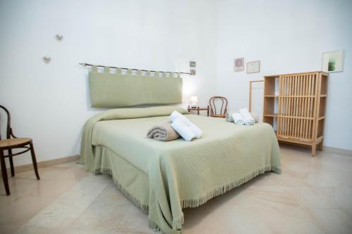 a bedroom with a bed with two pillows on it at Da Jaco in Castellammare del Golfo