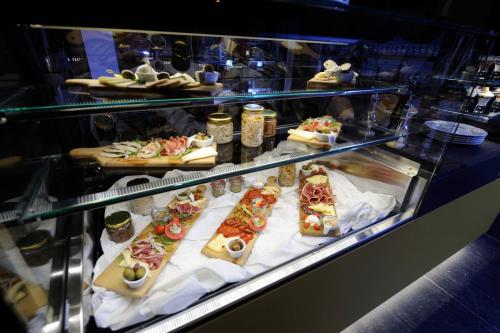 a display case filled with different types of food at Lakeside Hotel Plitvice in Plitvička Jezera