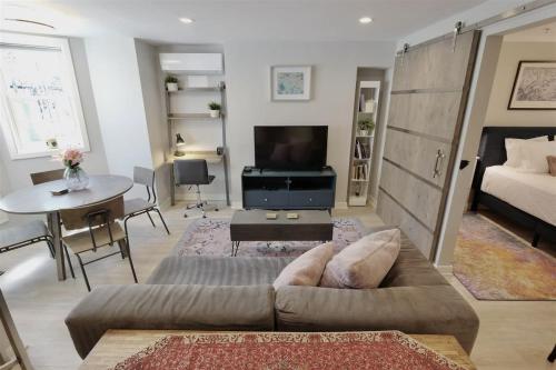 a living room with a couch and a table at Downtown DC Awaits with Parking Permit in Washington, D.C.