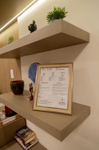 a shelf in a room with a picture on it at ArtStudio Open Spaces in Salvador