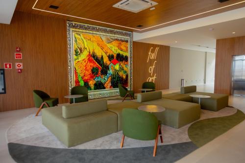 a lobby with a large painting on the wall at ArtStudio Open Spaces in Salvador