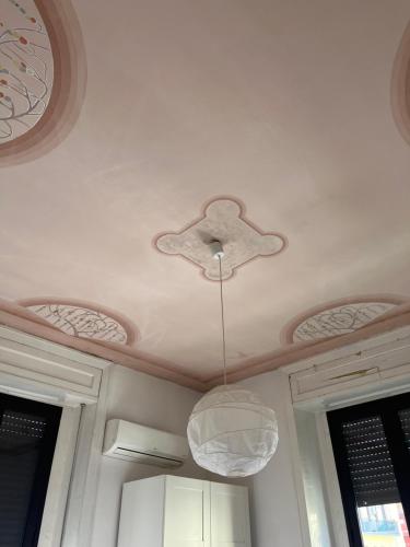 a ceiling with a light and a light fixture at Deodato guesthouse in Catania