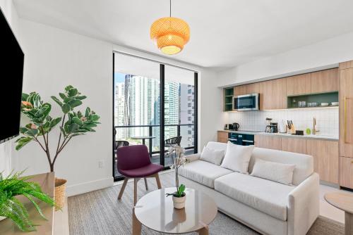 a living room with a couch and a table at New 26th floor amazing view 2BR-2BA in Miami