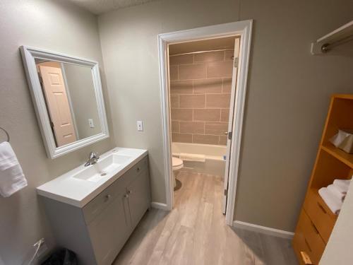 a bathroom with a sink and a toilet at Garden of the Gods Motel in Colorado Springs
