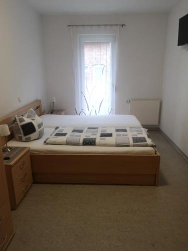 a large bed in a room with a window at Ferienhof Schnieder in Dülmen