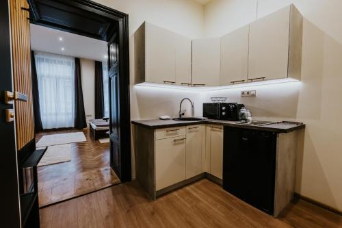 Dapur atau dapur kecil di SOHO Apartmanok